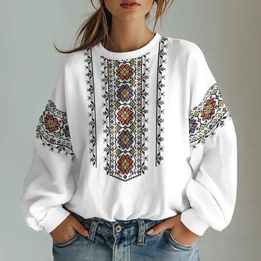 Ukrainian vishivanka style women's sweatshirt with floral design, vibrant colors, oversized fit, trendy long sleeves.