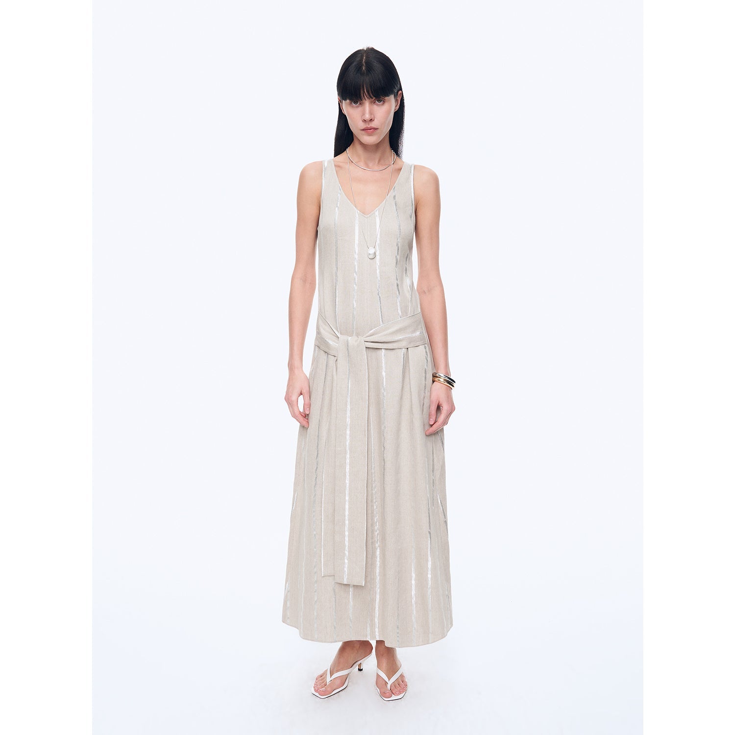 Milira Silver Stripe Linen Drape Dress with V-neck and A-line skirt, featuring an adjustable belt for an elegant silhouette.