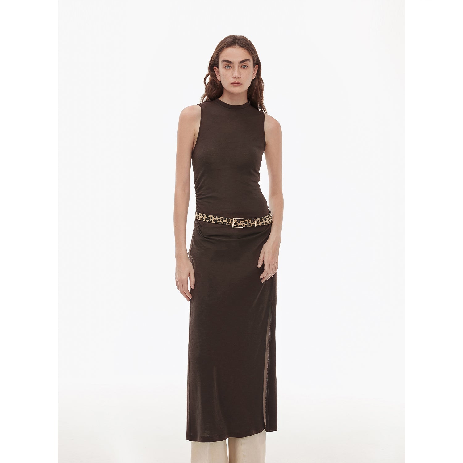 Model wearing Talyra Wool-Blend Knit Maxi Dress in dark chocolate with sleeveless design and side slit, showcasing elegant fit.