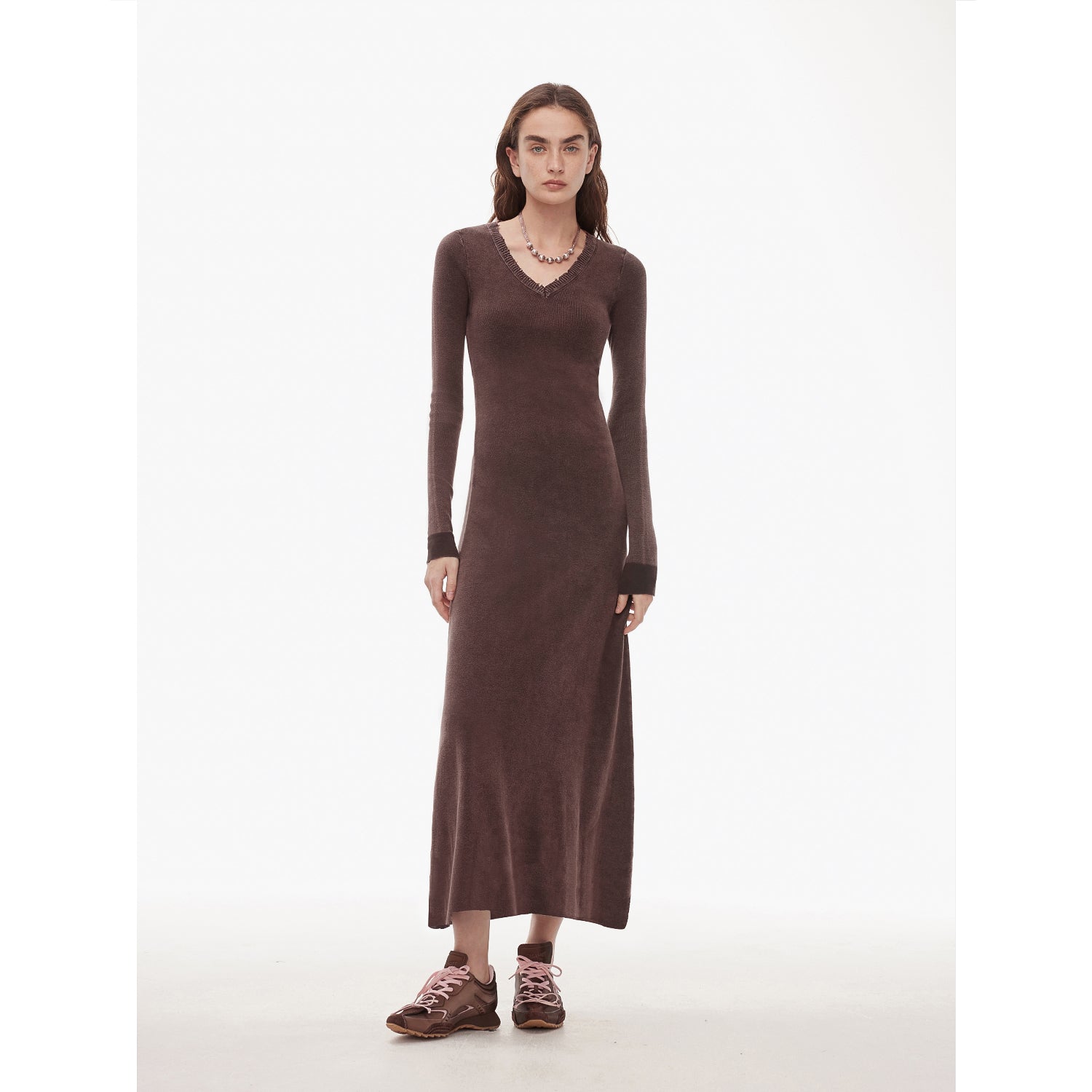 Selvara Distressed V-Neck Dress in brown with slim, contrast-tipped cuffs, showcasing a vintage look with raw-cut neckline.