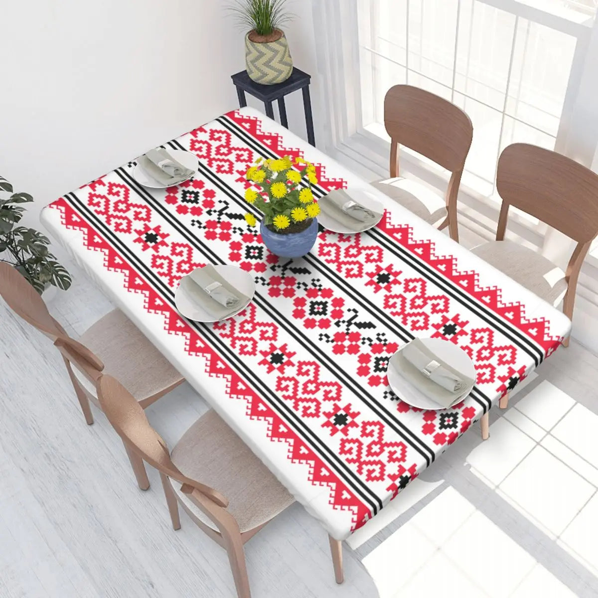 Ukrainian embroidery table cover with vibrant red and black design on dining table, enhancing home decor with traditional style.