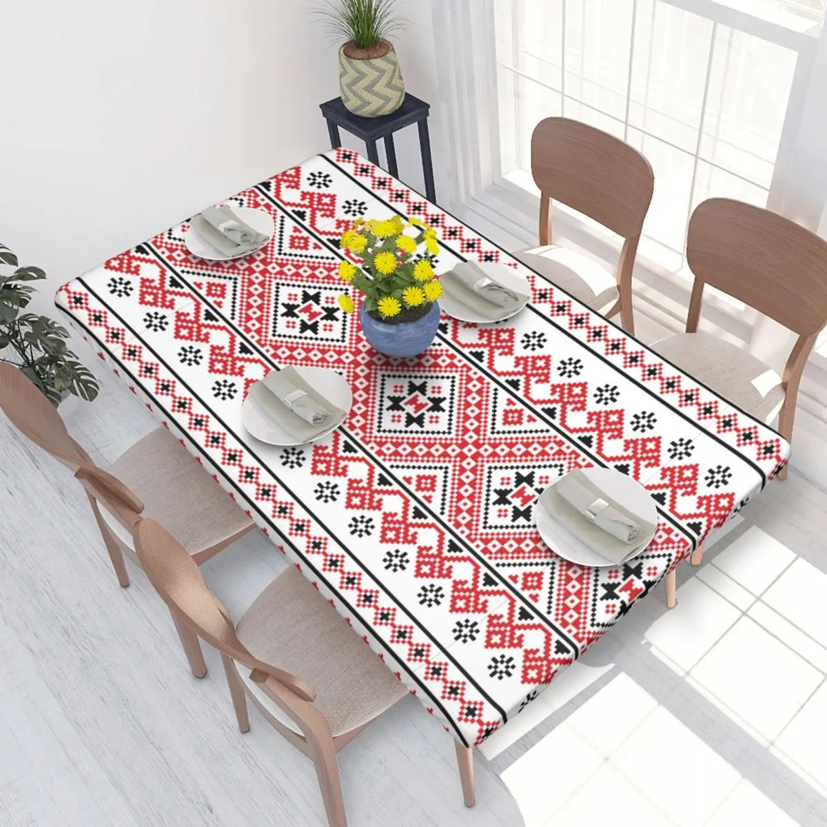 Ukrainian embroidery table cover on dining table, featuring intricate red and black patterns, perfect for home decor and special occasions.