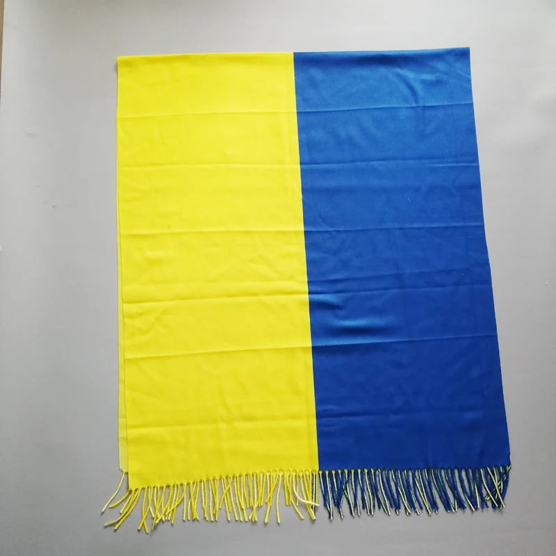 Luxurious Designer Ukraine Flag Cashmere Shawl in blue and yellow featuring elegant tassels, perfect for winter elegance.