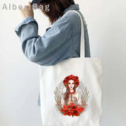 Woman carrying Ukrainian patriotic grocery tote bag with floral design.