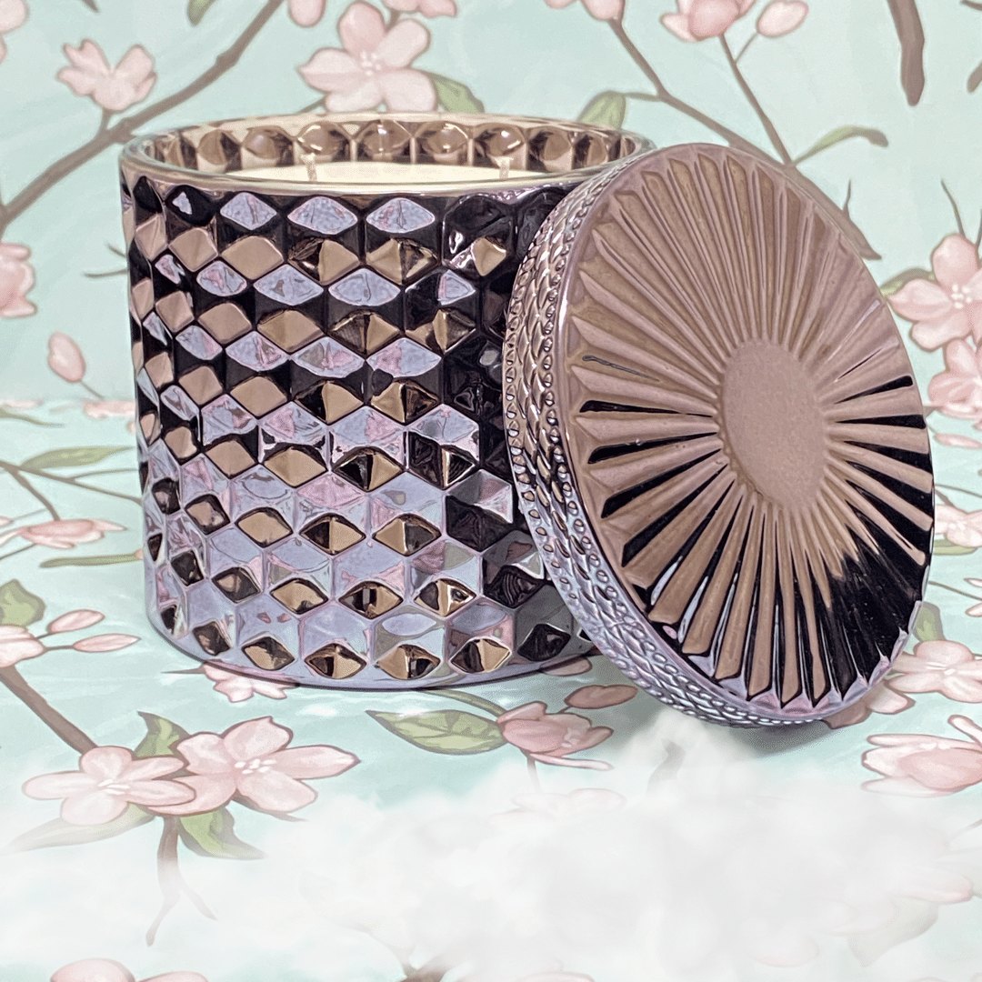 Elegant reusable container of Cashmere Dreams scented candle, adding luxury and ambiance with notes of white grapefruit and warm amber.