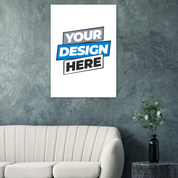 Art poster mockup in modern living room with a gray textured wall and white sofa, featuring a plant on a nearby table.