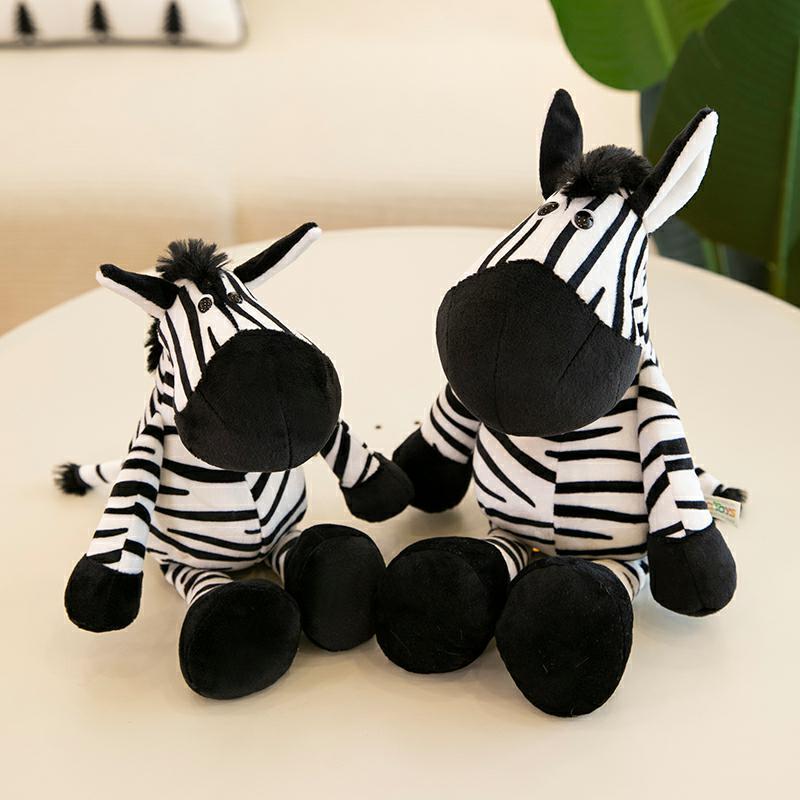 Two zebra plush toys from Jungle Animal Plush Toys collection, made of soft PP cotton, sitting on a white surface.