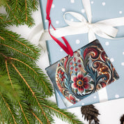 Ukrainian style acrylic ornament with floral design, displayed on a gift box with ribbon, surrounded by festive pine branches.