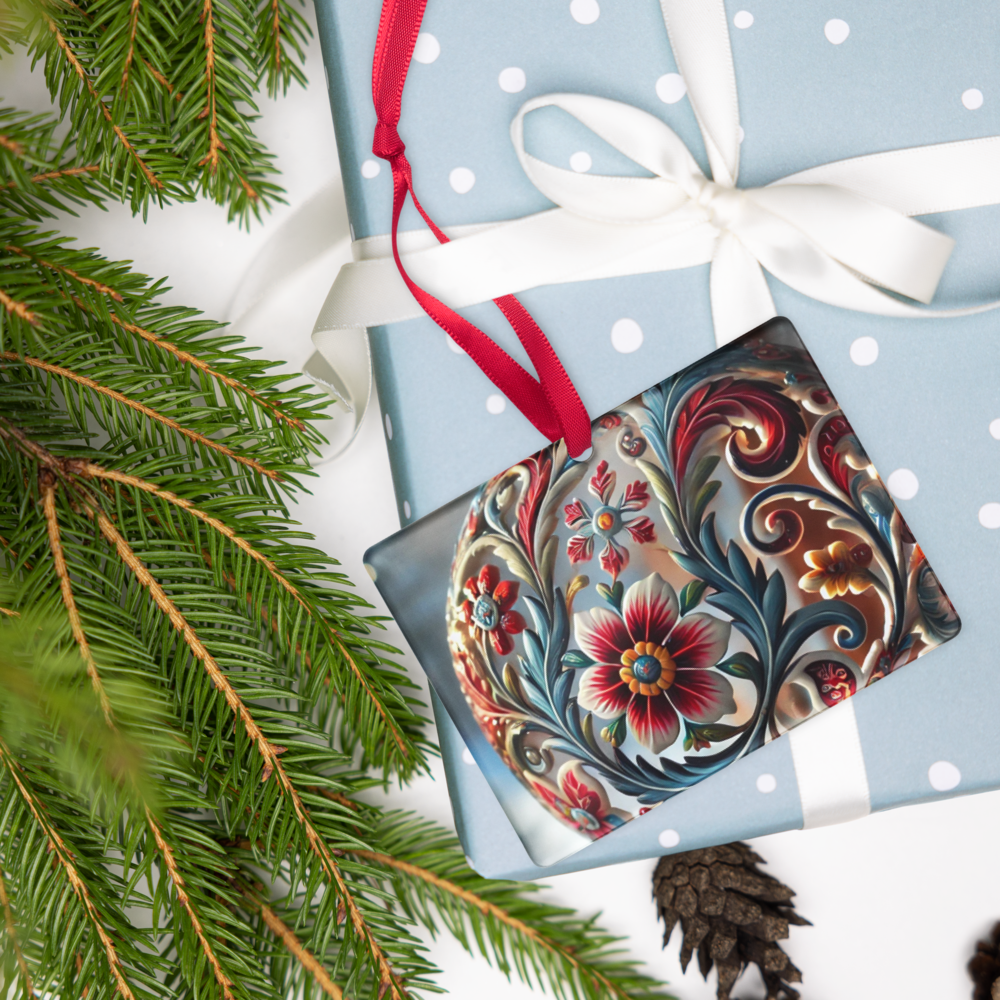 Ukrainian style acrylic ornament with floral design on a wrapped gift, featuring a red ribbon and surrounded by evergreen branches.