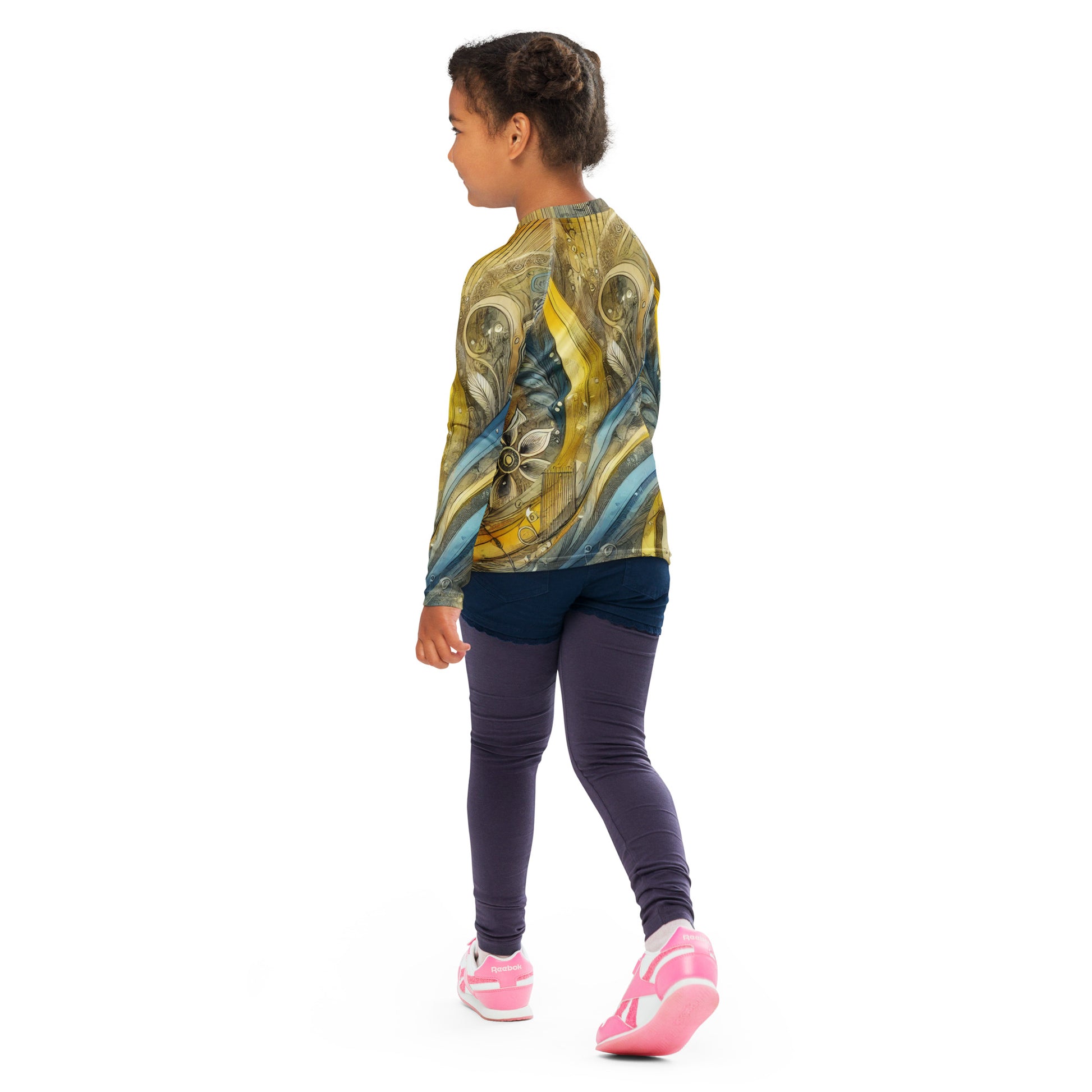 Child wearing a long-sleeve rash guard with Ukrainian abstract design, ideal for sun protection and beach activities.