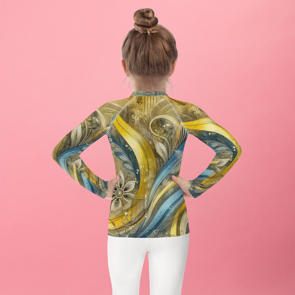 Kid wearing a vibrant rash guard with Ukrainian abstract design, showing long sleeves for sun protection, against a pink background.