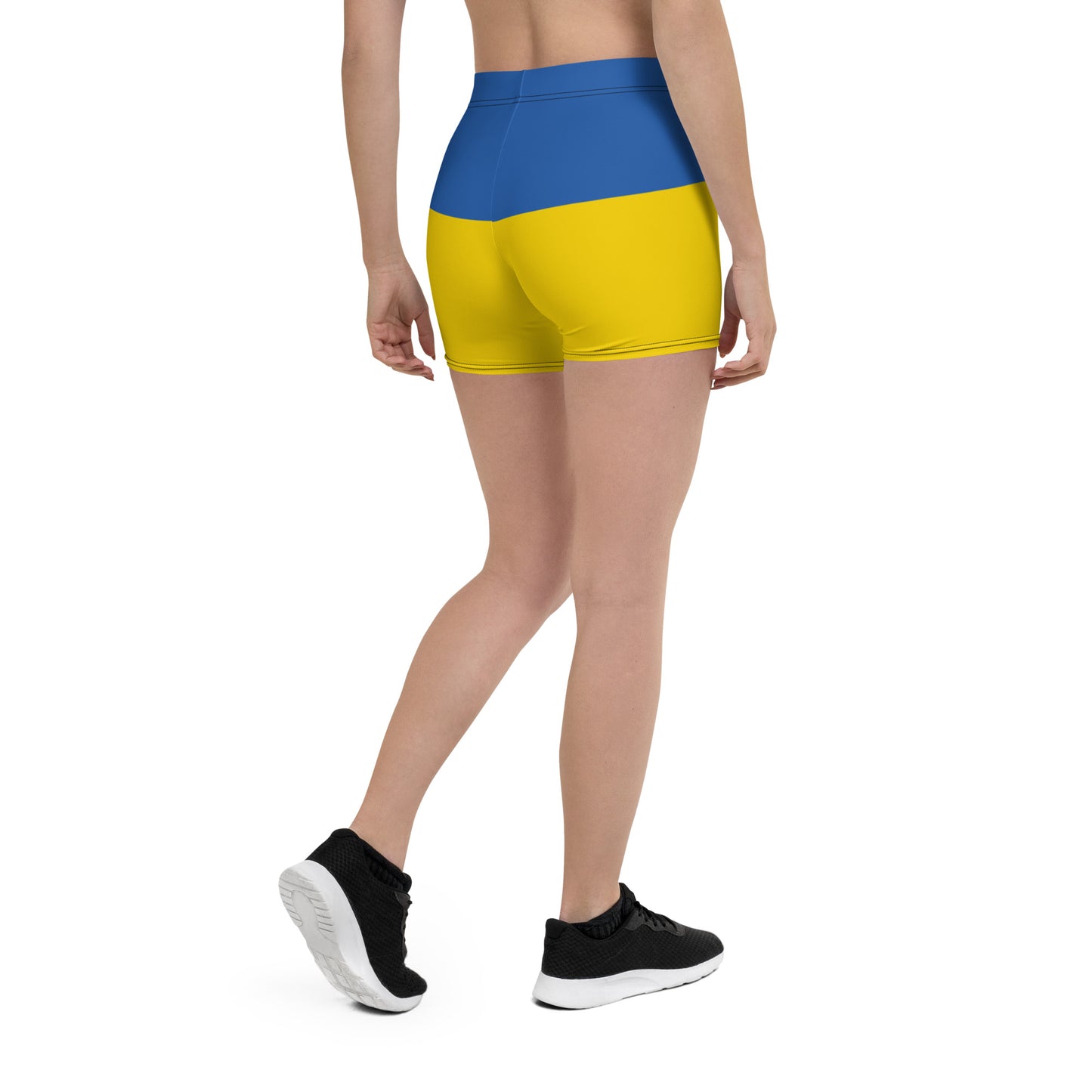 Woman wearing Ukrainian Flag shorts from the Ukrainian Vibe Trizub Collection, showcasing vibrant blue and yellow design.