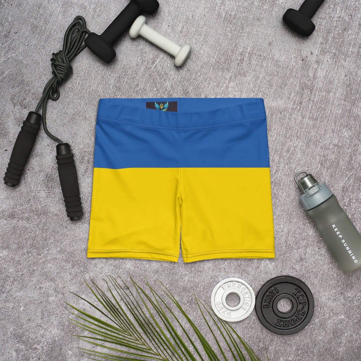 Ukrainian Flag shorts with workout essentials, part of the Ukrainian Vibe Trizub Collection, featuring vibrant blue and yellow prints.