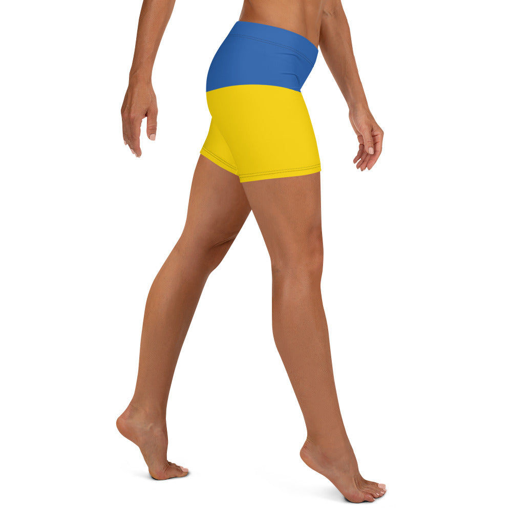 Woman wearing Ukrainian Flag shorts with blue and yellow design from the Ukrainian Vibe Trizub Collection.