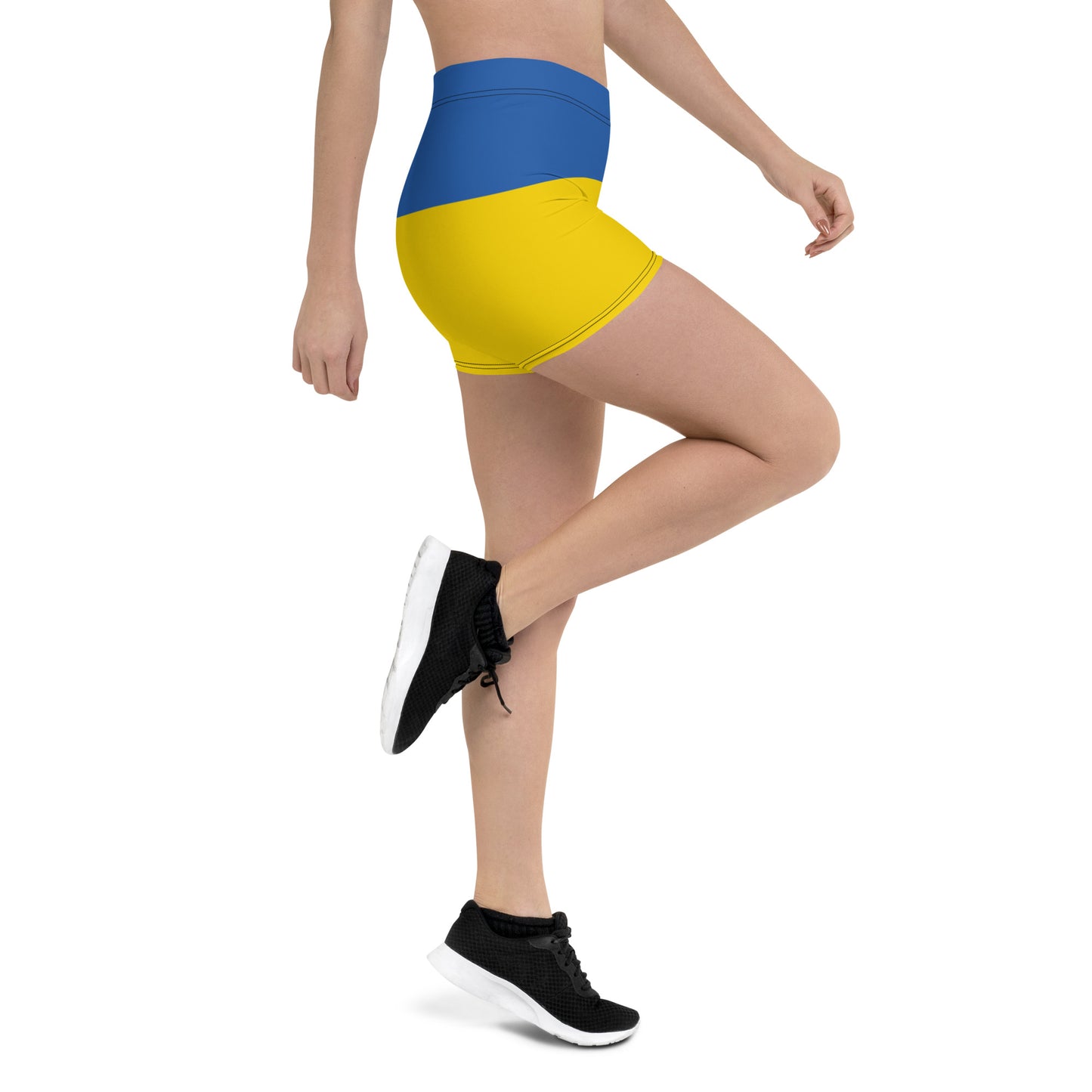 Woman wearing Ukrainian Flag shorts from Ukrainian Vibe Trizub Collection, showcasing vibrant blue and yellow design.