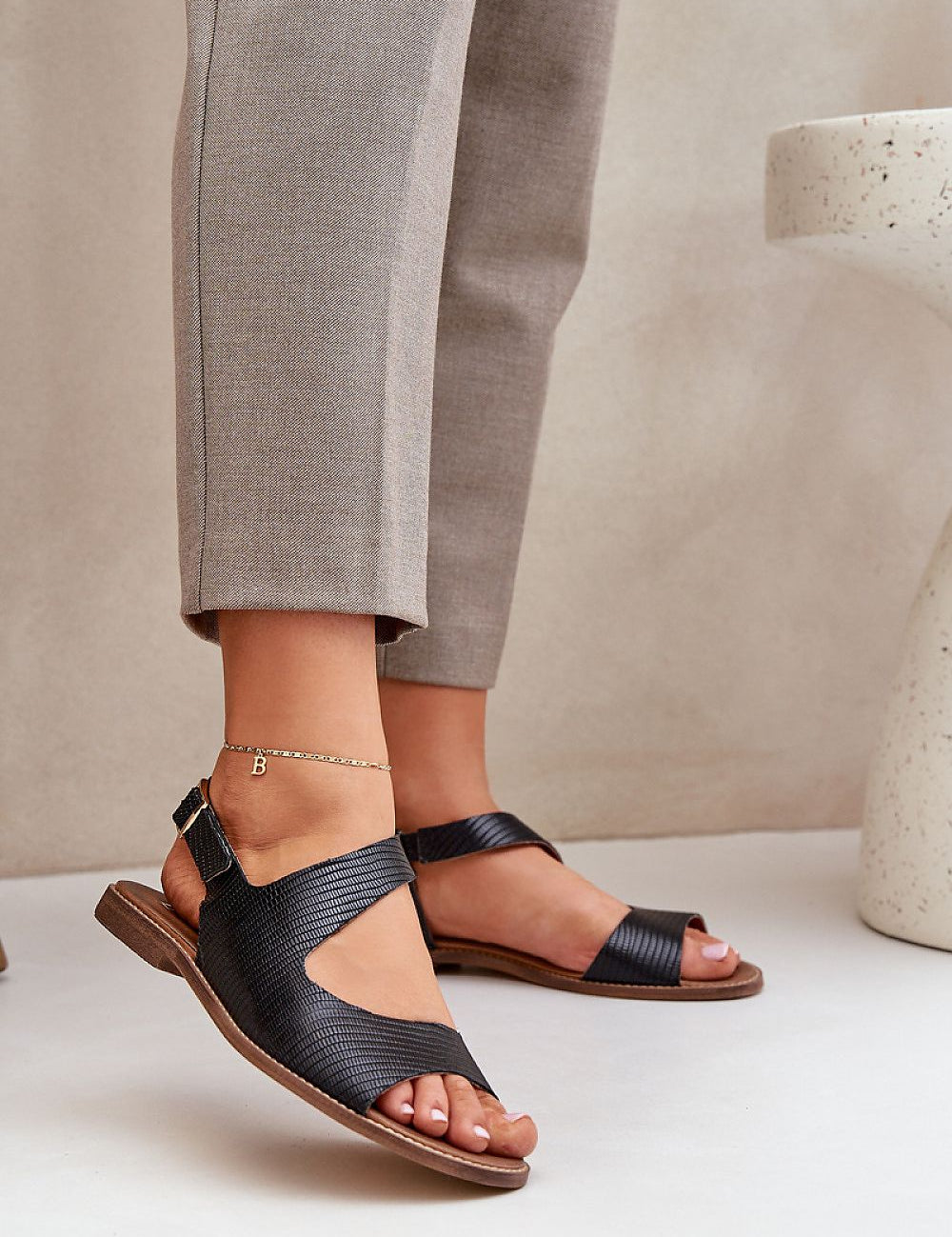 Almira Minimal Leather Sandals with adjustable buckle strap, showcasing a sleek design and comfortable fit, perfect for summer fashion.