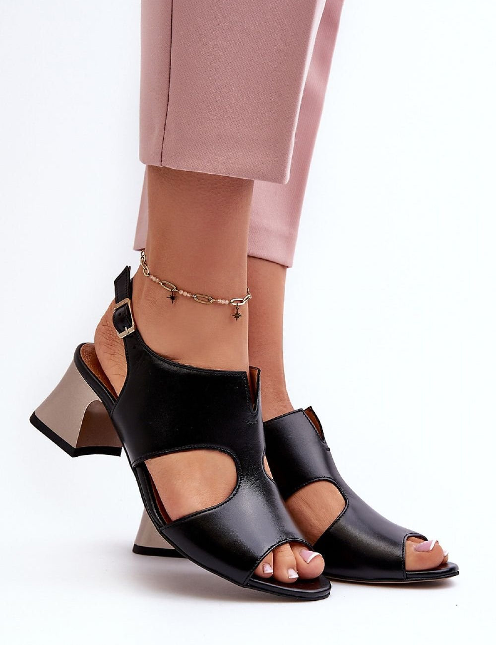 Ariessa Leather Heel Sandals in black, featuring adjustable buckle strap and open toe design for comfort, worn with pink cropped pants.