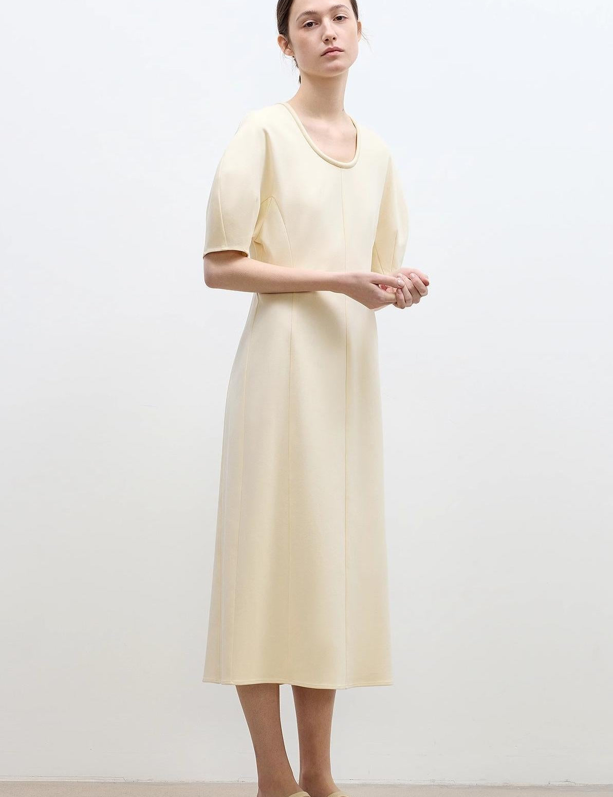 Aurelia Cotton Rope Knit Dress on model, showcasing relaxed tailoring with elegant wide silhouette, micro-mercerized cotton fabric