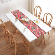Authentic Ukrainian embroidery table cover on dining table, showcasing intricate patterns and vibrant colors.