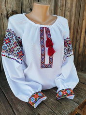Authentic Ukrainian Vyshyvanka with traditional embroidery on white homespun fabric, showcasing cultural heritage and elegance.