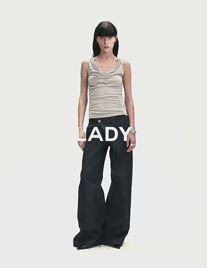 Model wearing a Zirellin Drape Contour Vest with a draped neckline and soft pleats, paired with wide-leg pants against a white background.