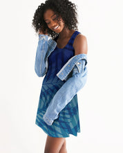 Woman wearing a blue Sunset Hour Racerback Dress with a denim jacket, showcasing its relaxed fit and casual charm.