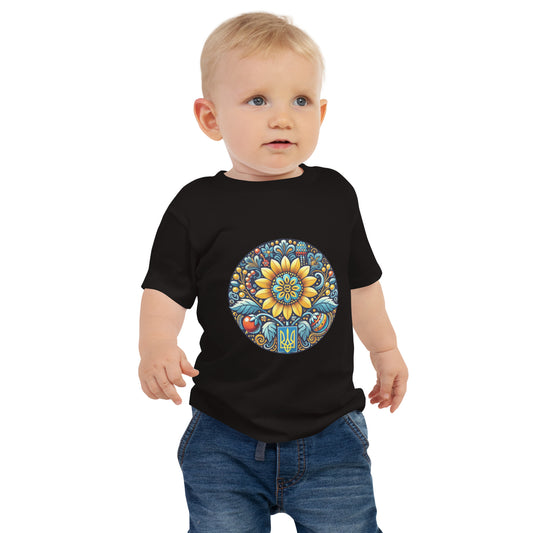 Baby wearing black jersey tee with colorful Ukrainian symbol design, made from soft combed cotton for comfort and style.