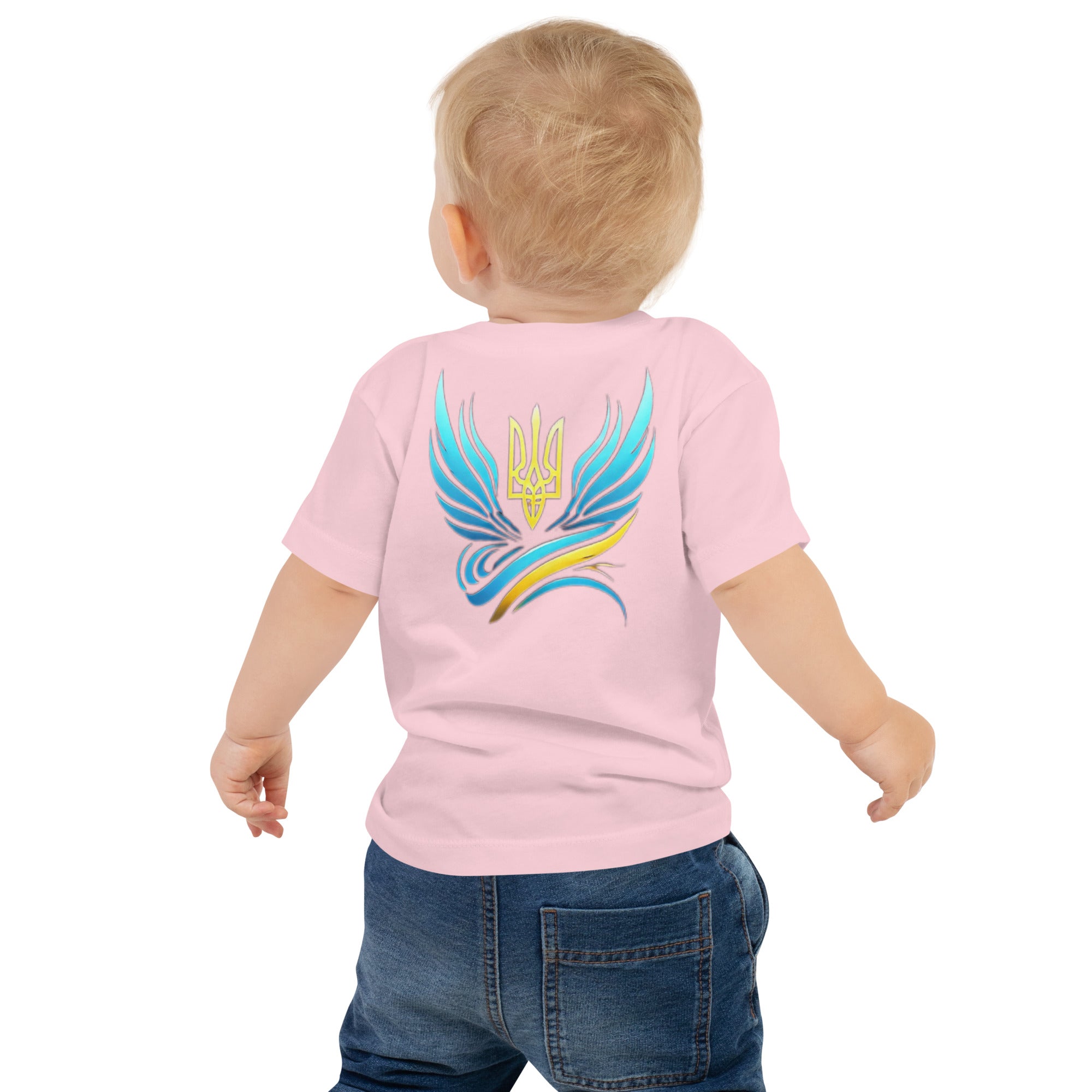 Baby wearing pink tee with Ukrainian symbol design on back, showcasing vibrant colors and comfortable cotton fabric.