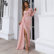 Elegant pink one-shoulder sequin gown with asymmetrical neckline, perfect for formal events like galas and red carpet occasions.