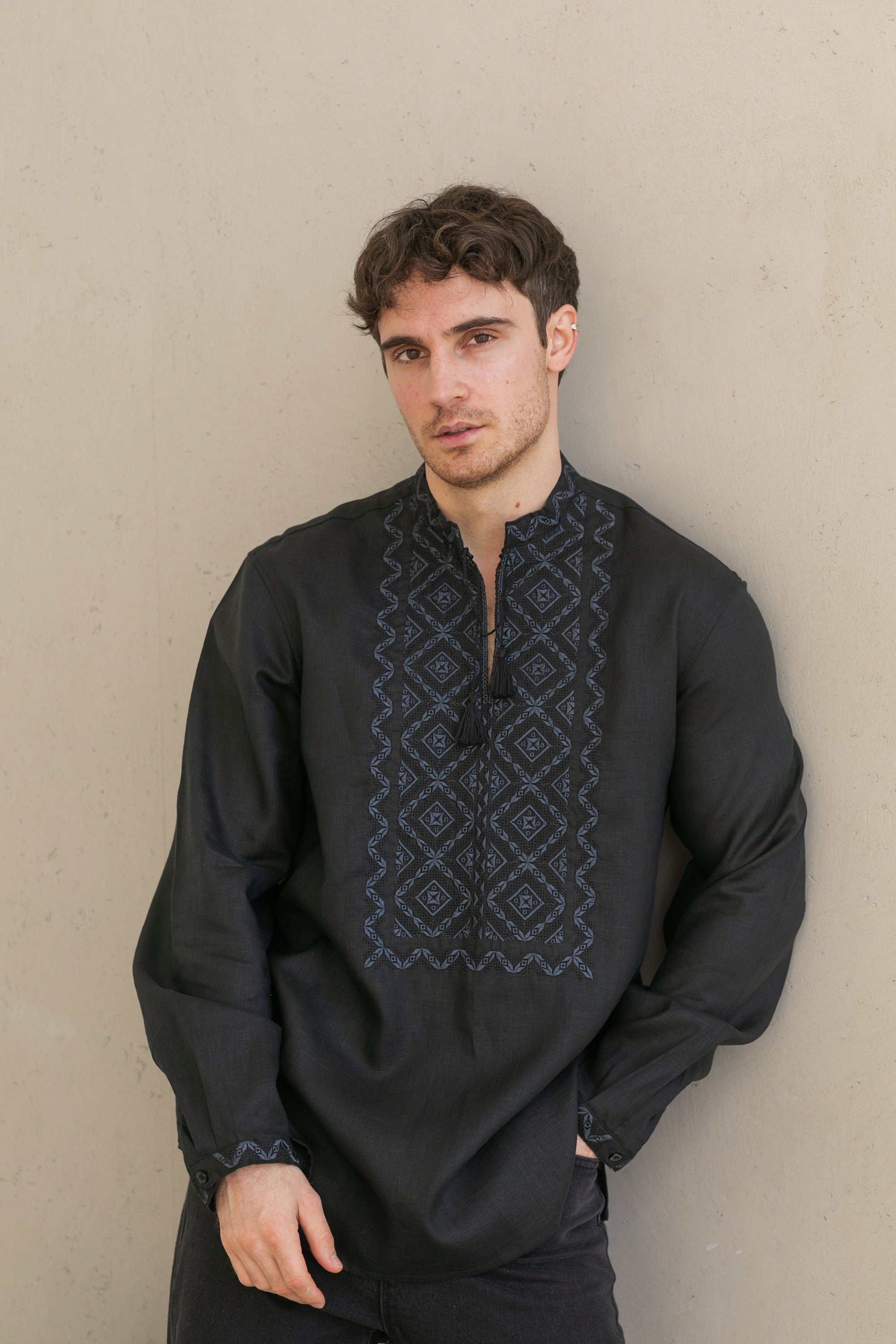 Black linen men's shirt with Ukrainian Poltava embroidery, featuring black-on-black cross-stitch designs. Traditional Vyshyvanka.
