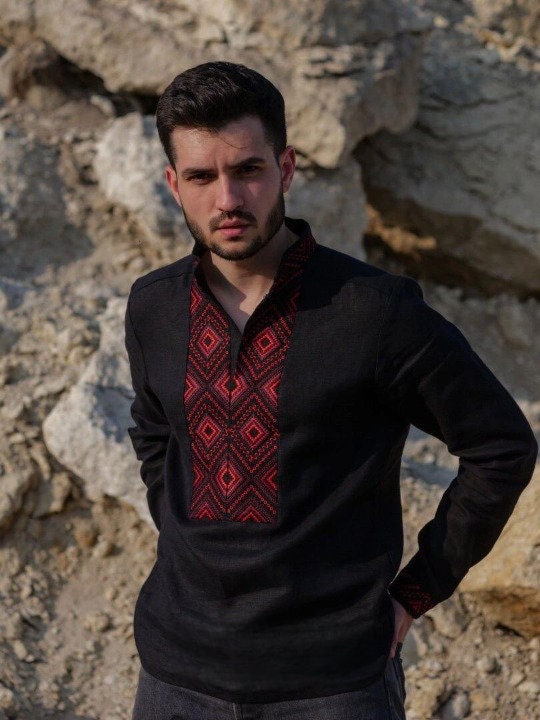 Black linen men's shirt with red geometric embroidery, traditional Ukrainian Vyshyvanka, stand-up collar, long sleeves.