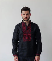 Black linen men’s shirt with red geometric embroidery, featuring Ukrainian Vyshyvanka design and a stand-up collar.