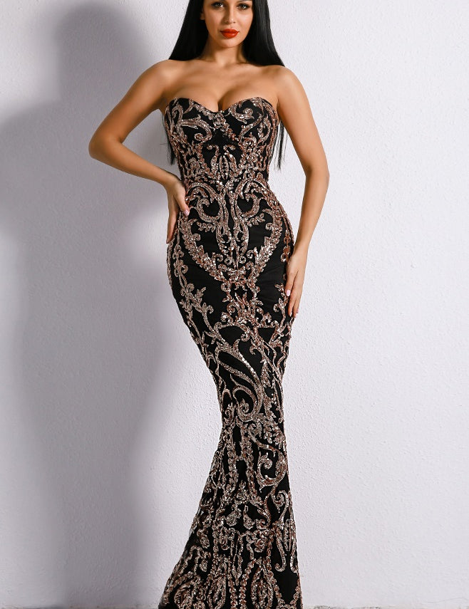Elegant black sequin evening gown with intricate patterns, strapless design, and floor-length silhouette, perfect for formal events.