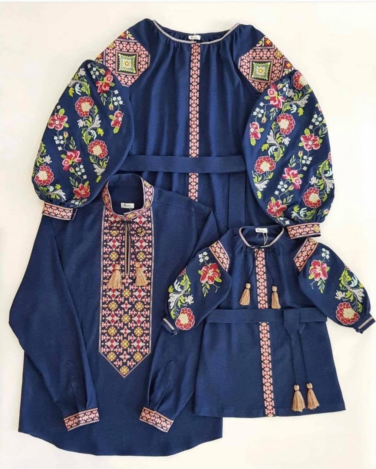 Blue embroidered Ukrainian vyshyvanka shirt and dress set with floral patterns, showcasing traditional design and craftsmanship.