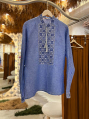 Blue linen Ukrainian embroidered Vyshyvanka shirt with Alatyr sign, stand-up collar, long sleeves, and inner fastening tab.