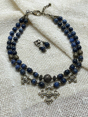 2025 Blue Ukrainian Necklace "Magic of the Night" with sodalite stones and bronze accents on textured fabric background.