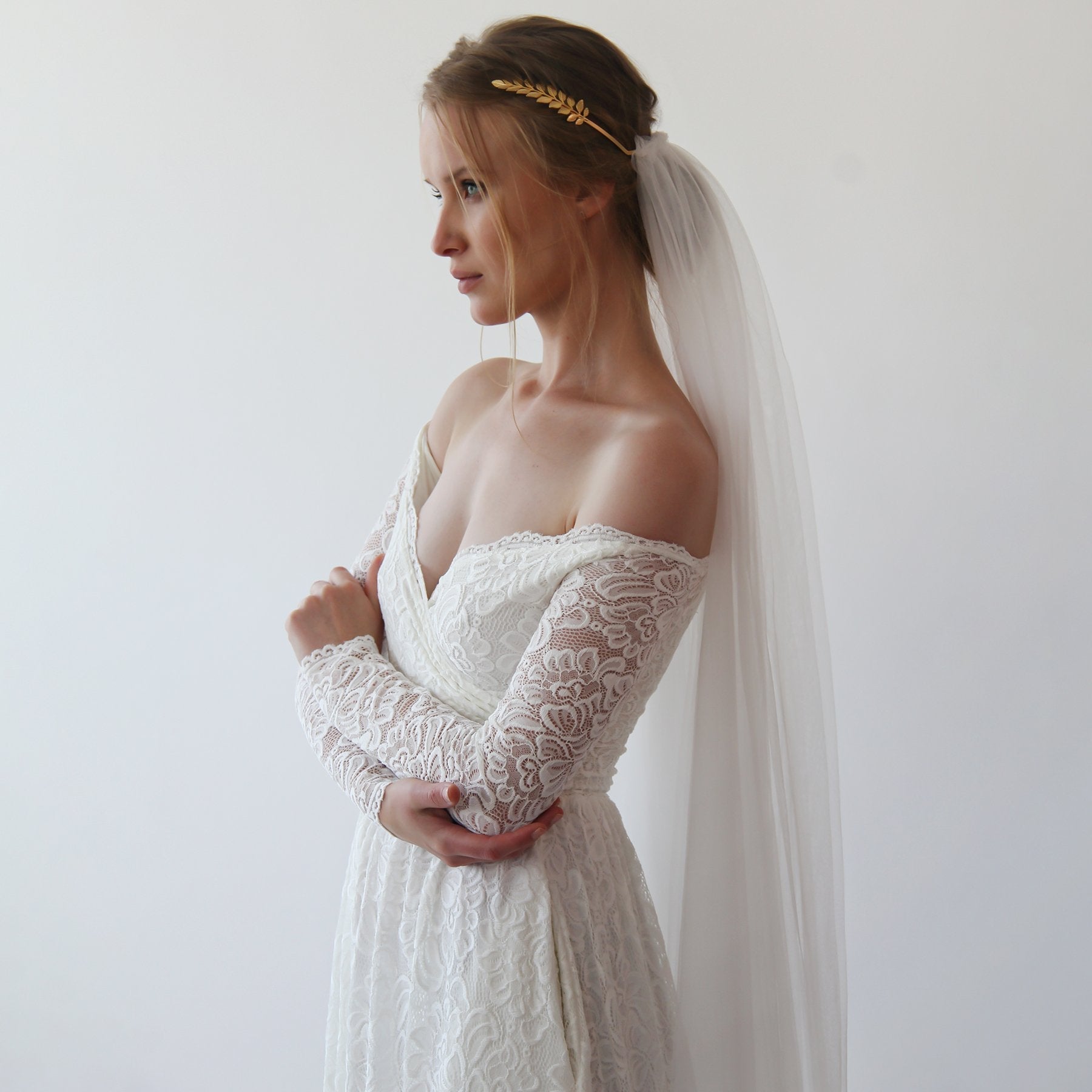 Bride wearing Elthira Tulle Veil with Gold Leaf Crown, showcasing elegant lace wedding dress and minimalist bridal style.