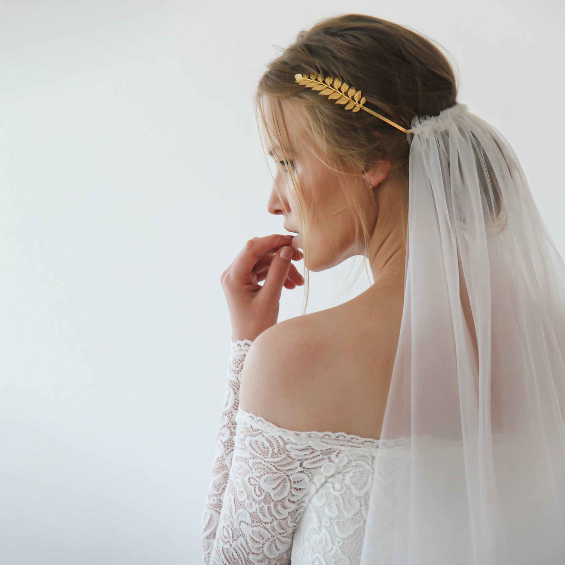 Bridal wearing Elthira Tulle Veil with Grecian gold leaf crown, showcasing elegant and ethereal wedding style.