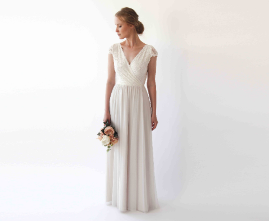 Iselwen Wrap Lace Bridal Gown with V neckline and chiffon skirt, featuring elegant lace cap sleeves, perfect for modern weddings.