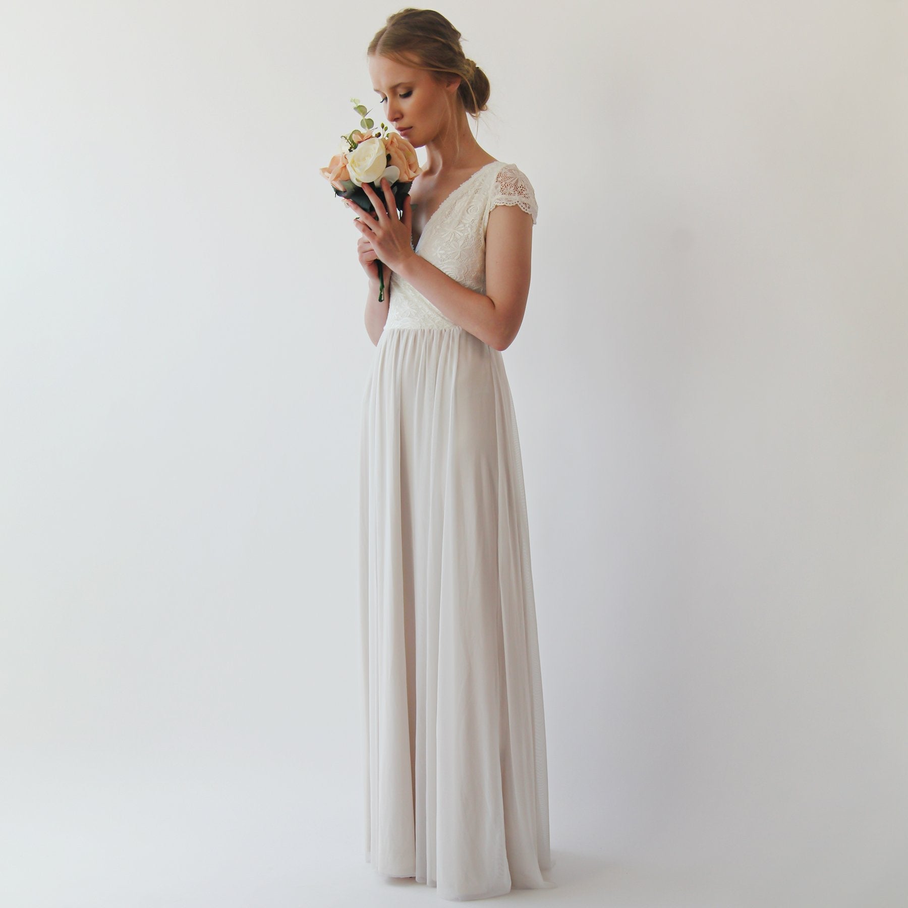 Iselwen wrap lace bridal gown with V neckline, lace cap sleeves, and flowing chiffon skirt. Elegant wedding dress elegance.