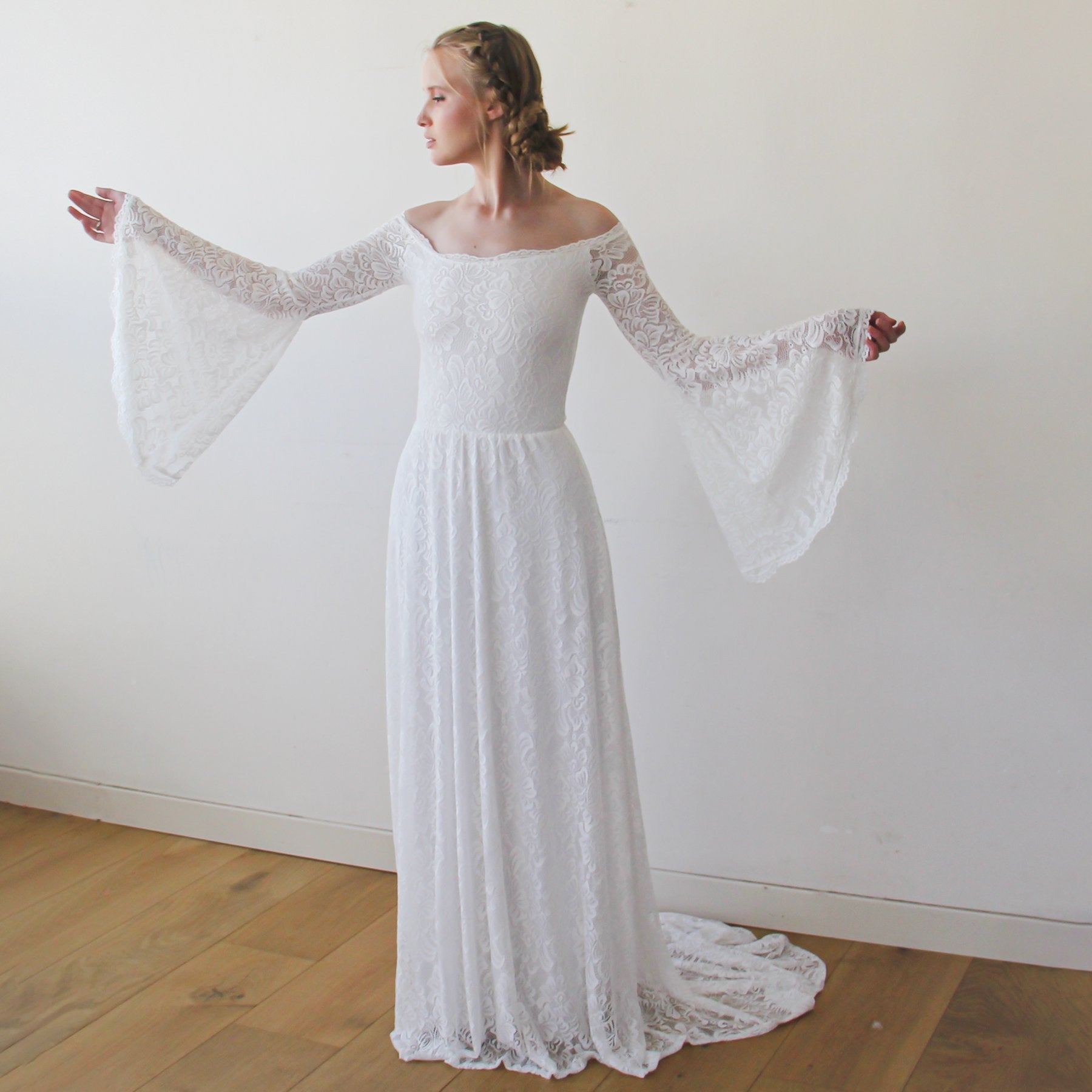 Bride wearing Lirienne Off-Shoulder Wedding Dress with lace bell sleeves and floor-length ivory silhouette.