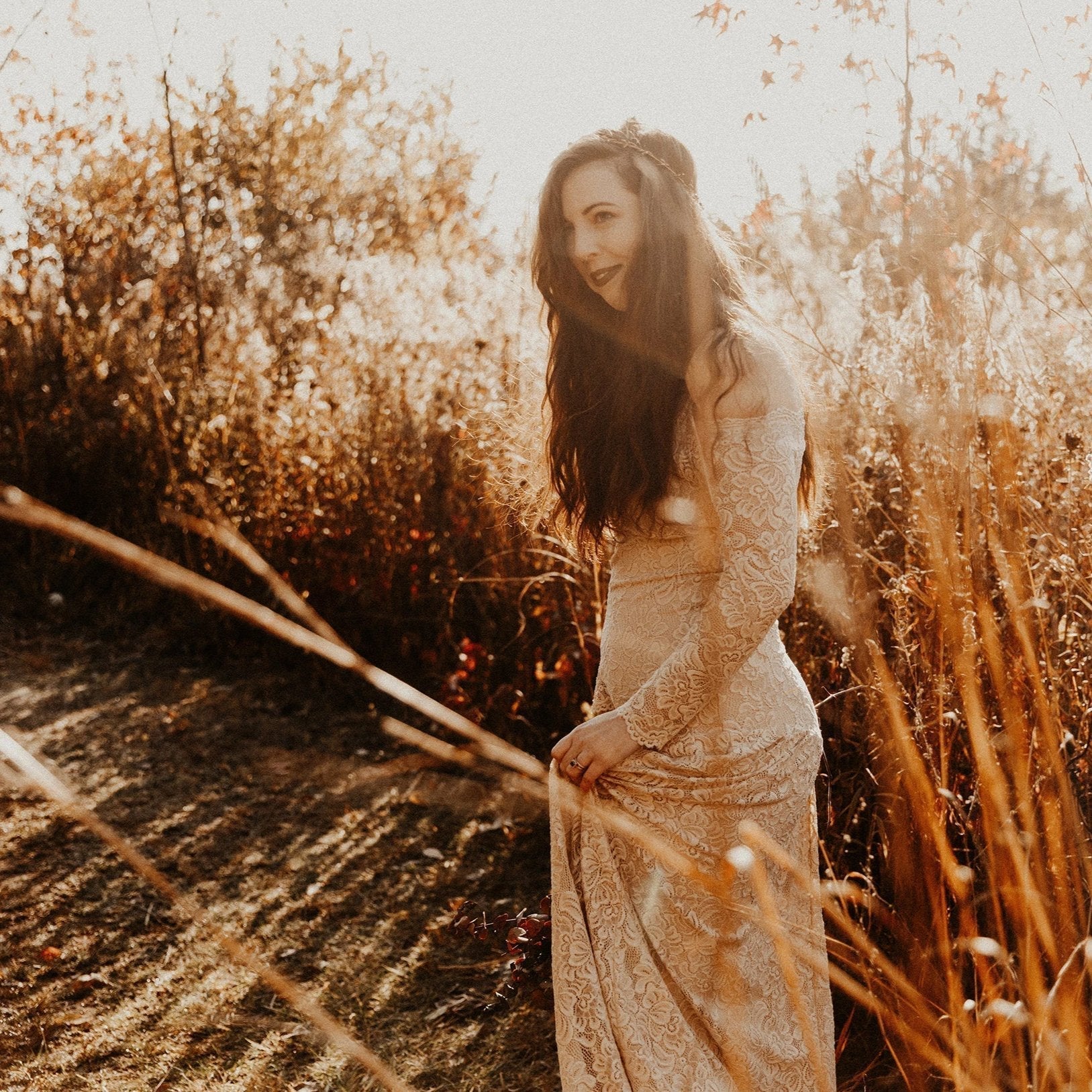 Woman in Elverin Medieval Lace Wedding Dress in autumn setting