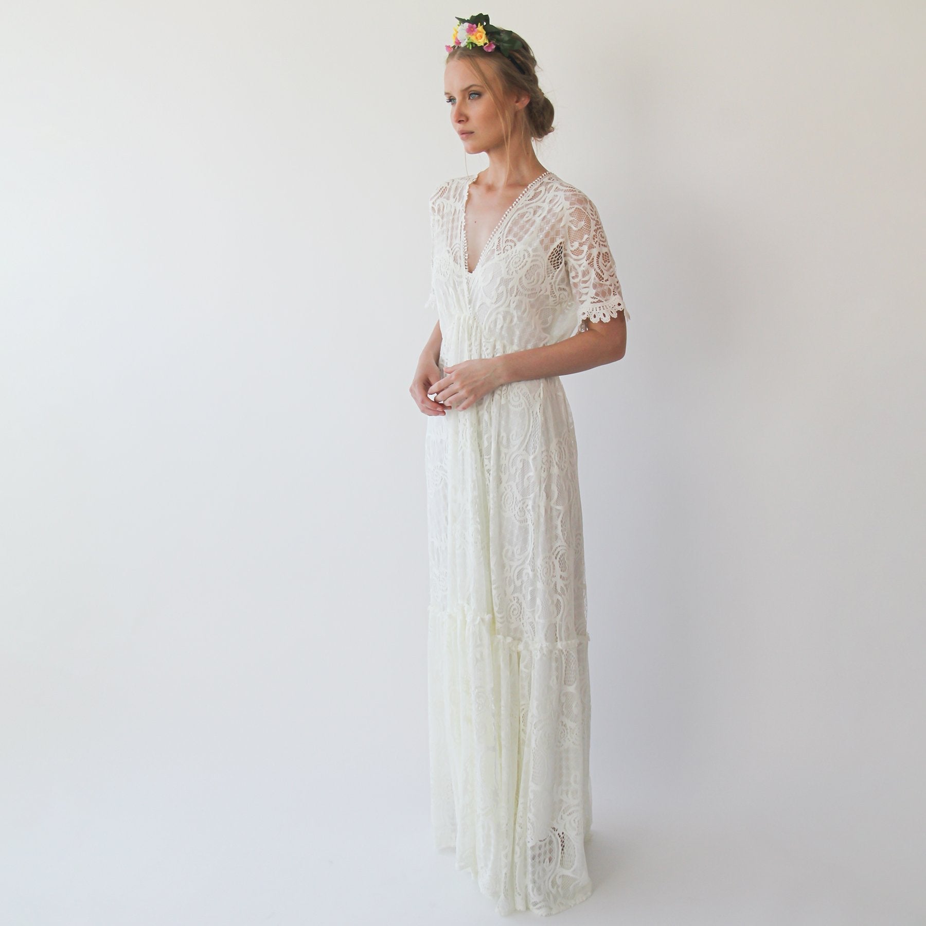 Ivairin lace wedding gown with floral lace, bat sleeves, and deep V-necklines for the boho bride, embodying vintage romance and grace.