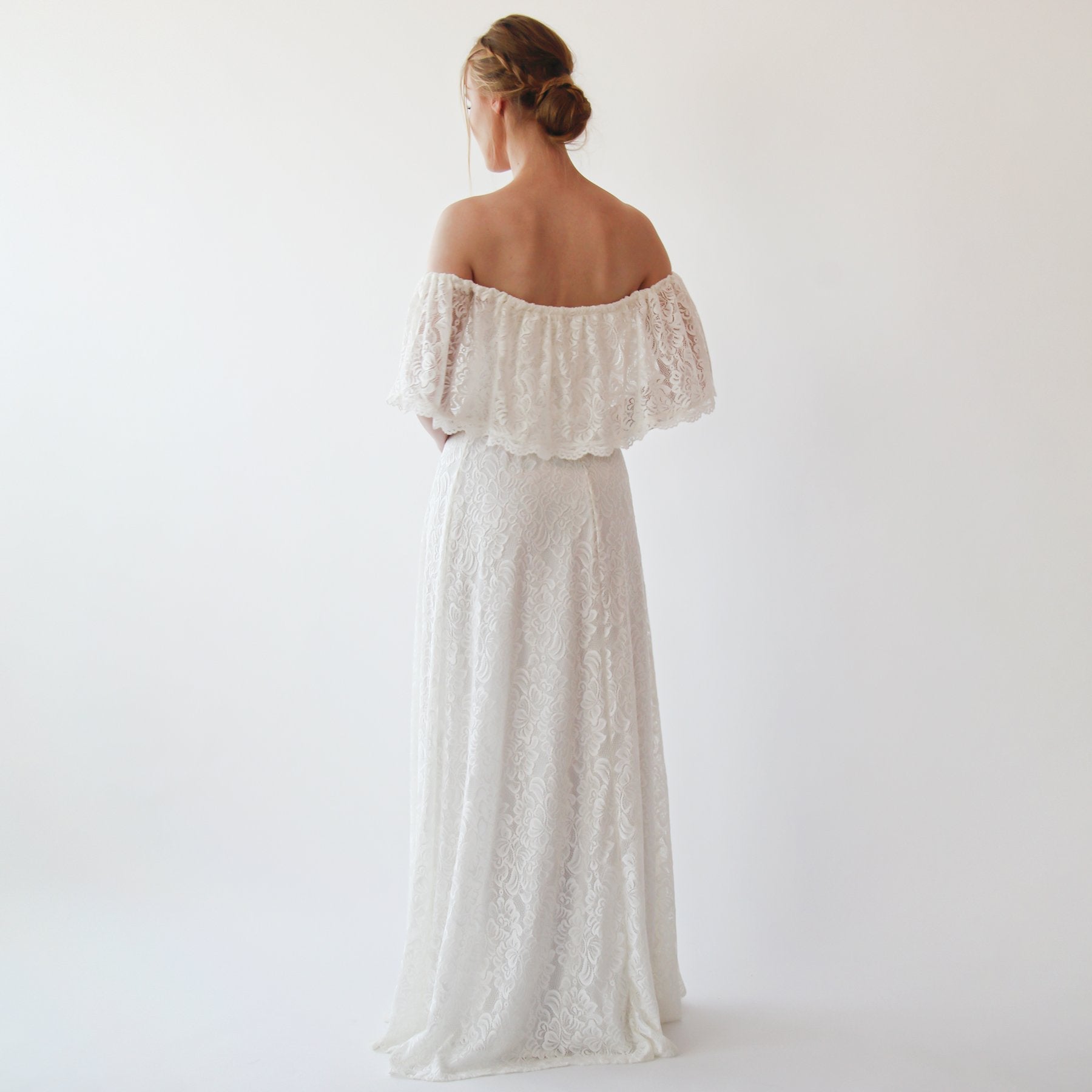 Aurevienne Crinkled Off-Shoulder Ivory Lace Dress with ruffled top, perfect for bohemian beach weddings and outdoor ceremonies.