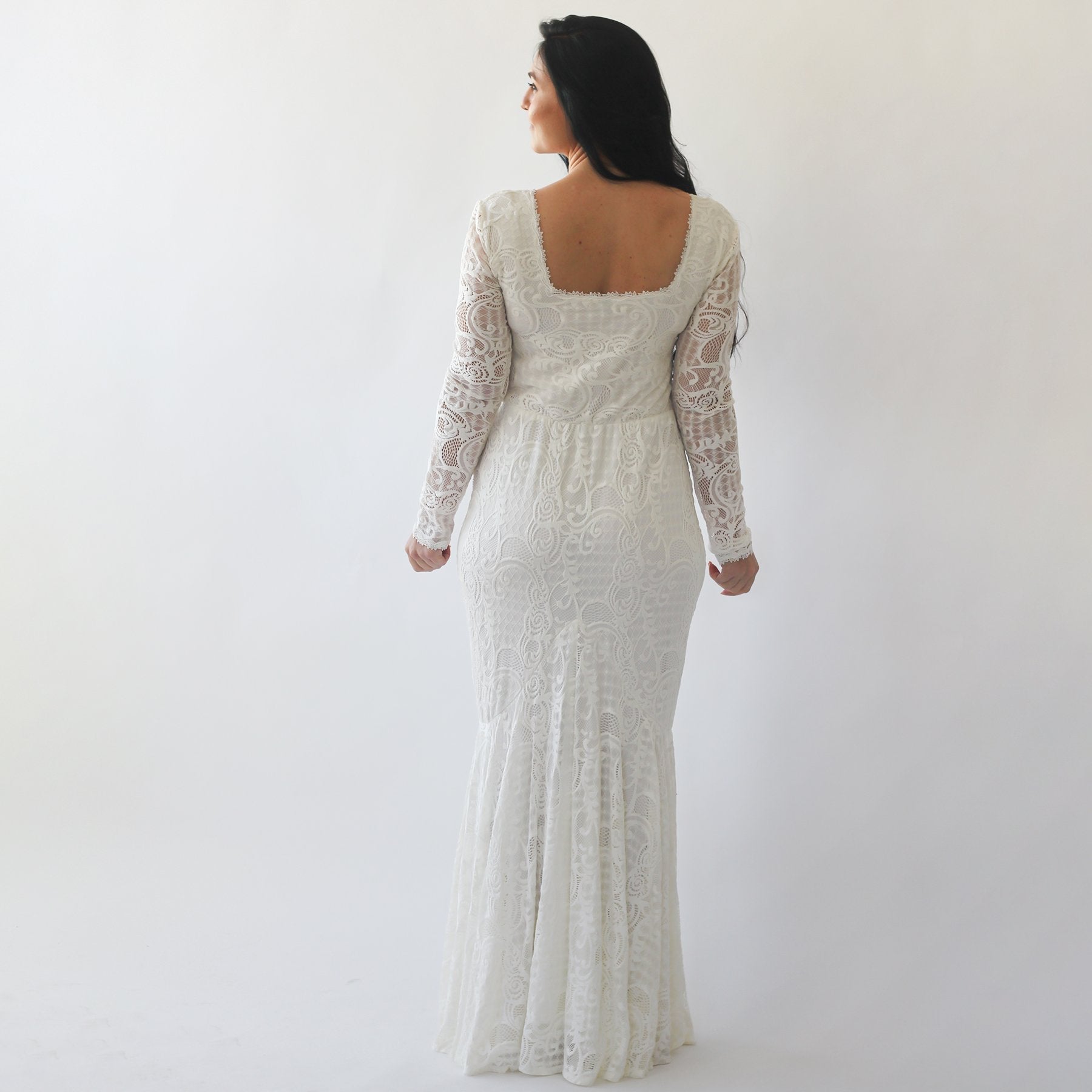 Back view of Elirelle Ivory Lace Wedding Dress with long sleeves, showcasing square neckline and elegant mermaid silhouette.