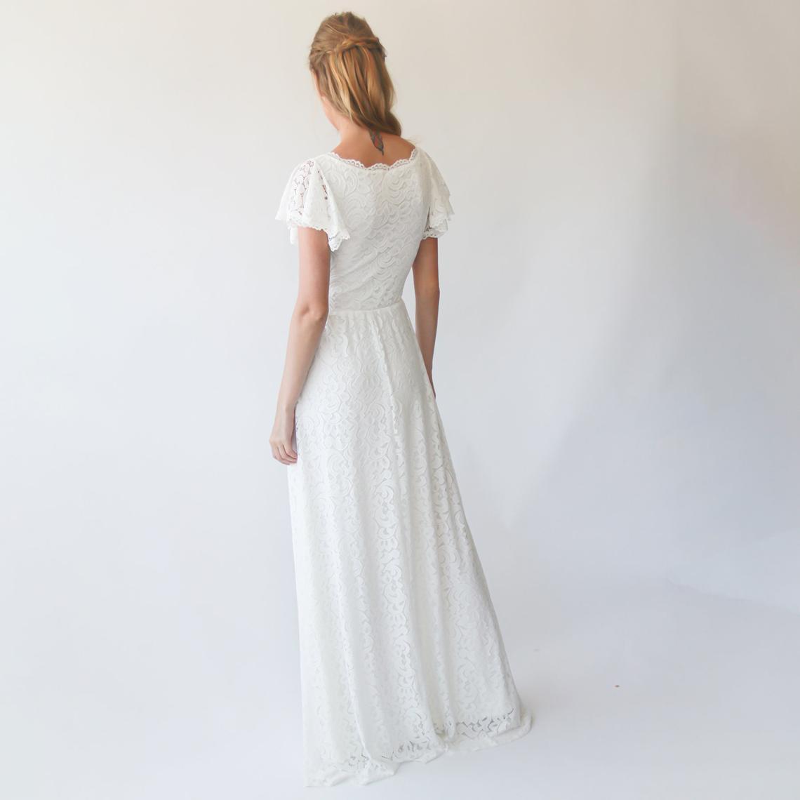 Back view of Elowen Lace Wrap Wedding Gown in ivory, featuring circular cap sleeves and a soft lace floor-length silhouette.