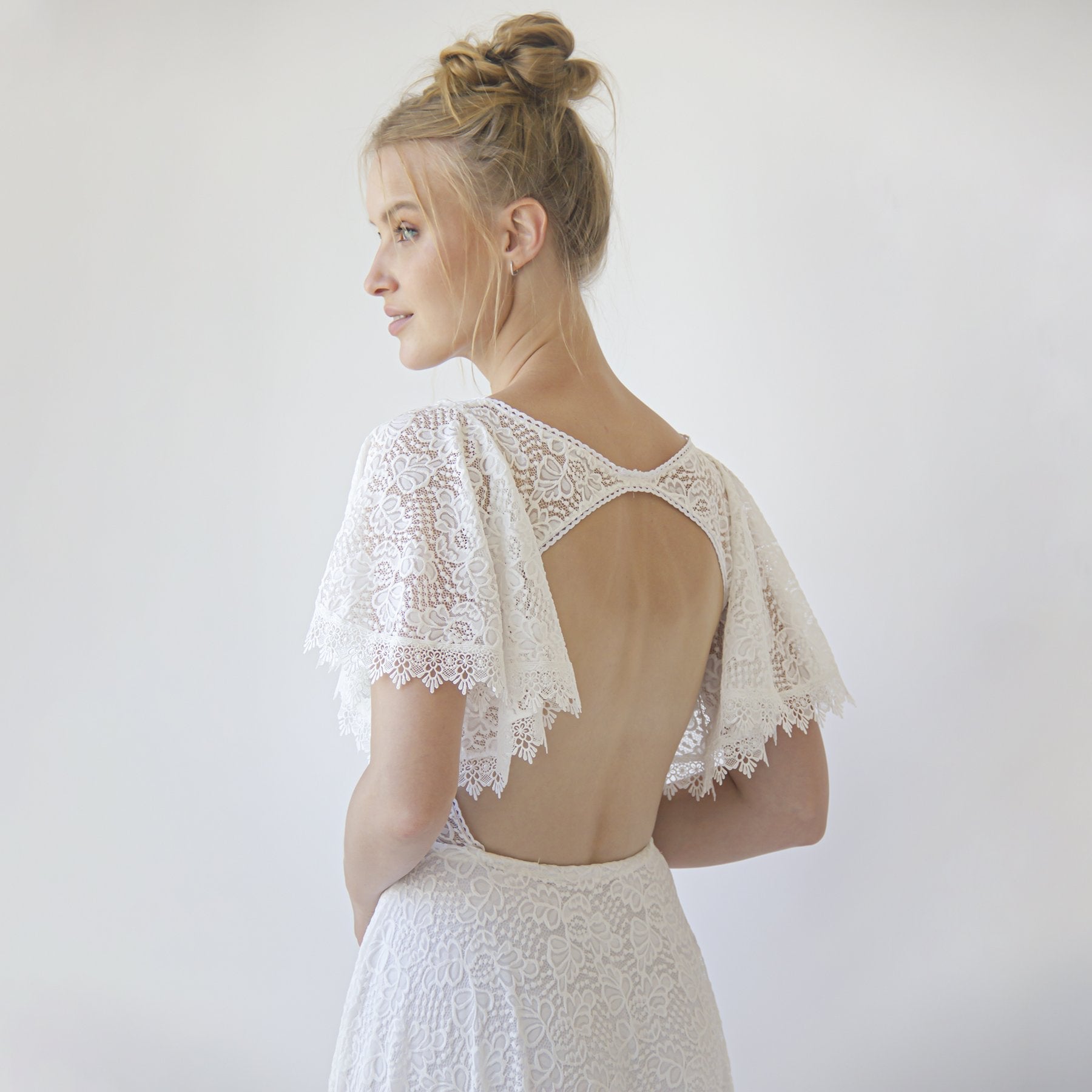 Solvene open back lace wedding dress with butterfly sleeves and bohemian details in ivory, elegant bridal fashion