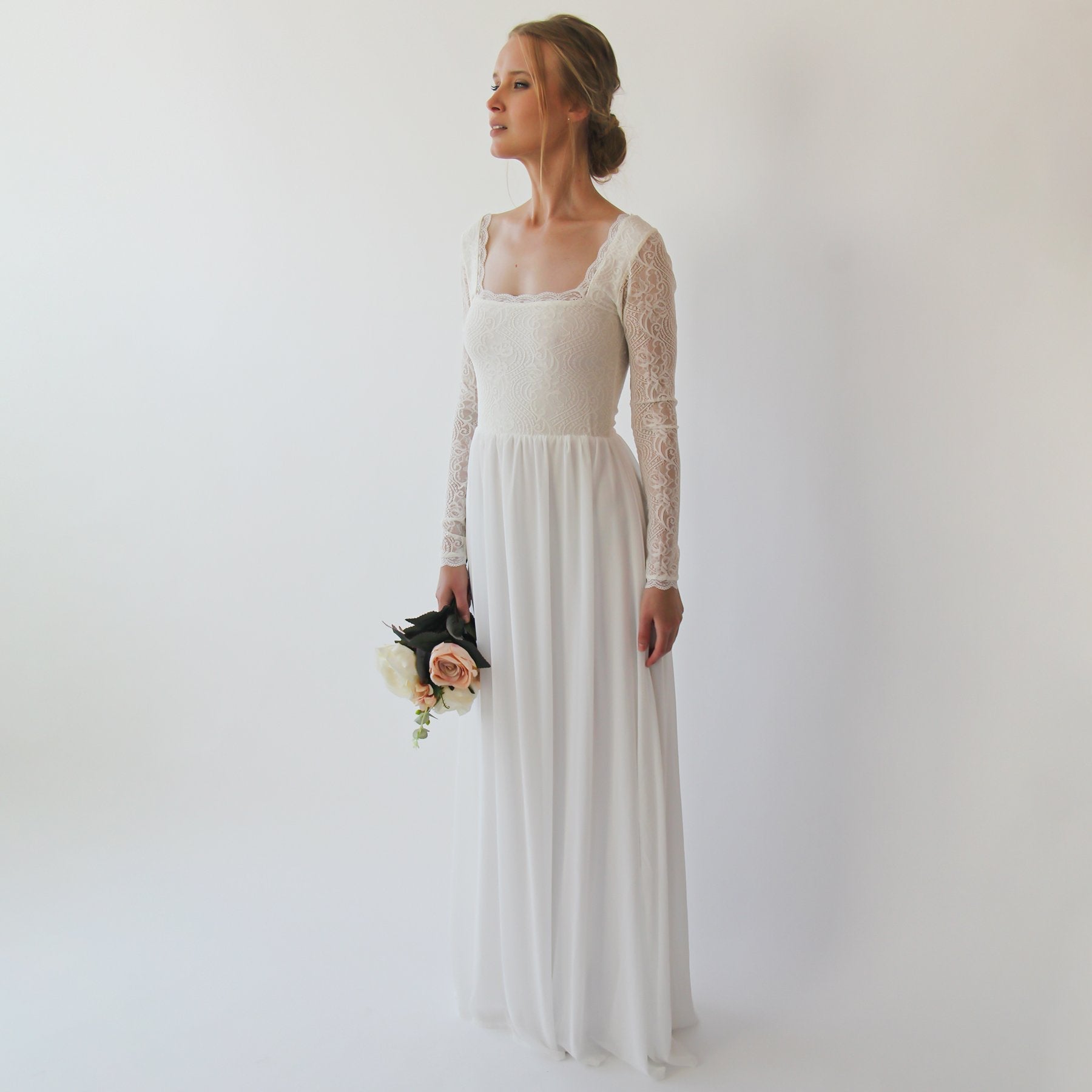 Naelira Square Neck Mesh Wedding Gown with lace bodice and chiffon skirt, long-sleeve design, floor-length elegance, bride holding flowers.