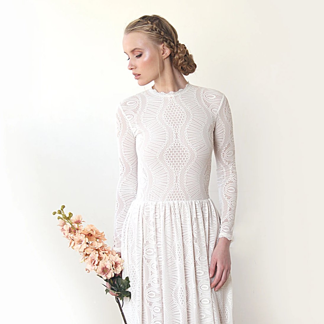 Elenthera Modest Train Wedding Gown in ivory lace with jewel neckline and long sleeves, showcasing timeless elegance for brides.
