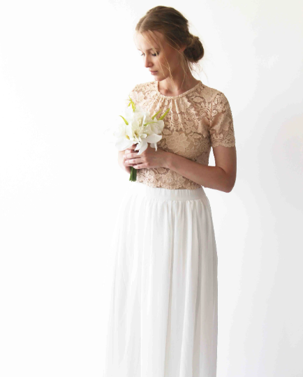Ethereal Meluvia bridal lace top and chiffon skirt set with floral bouquet, showcasing modern femininity and timeless elegance.